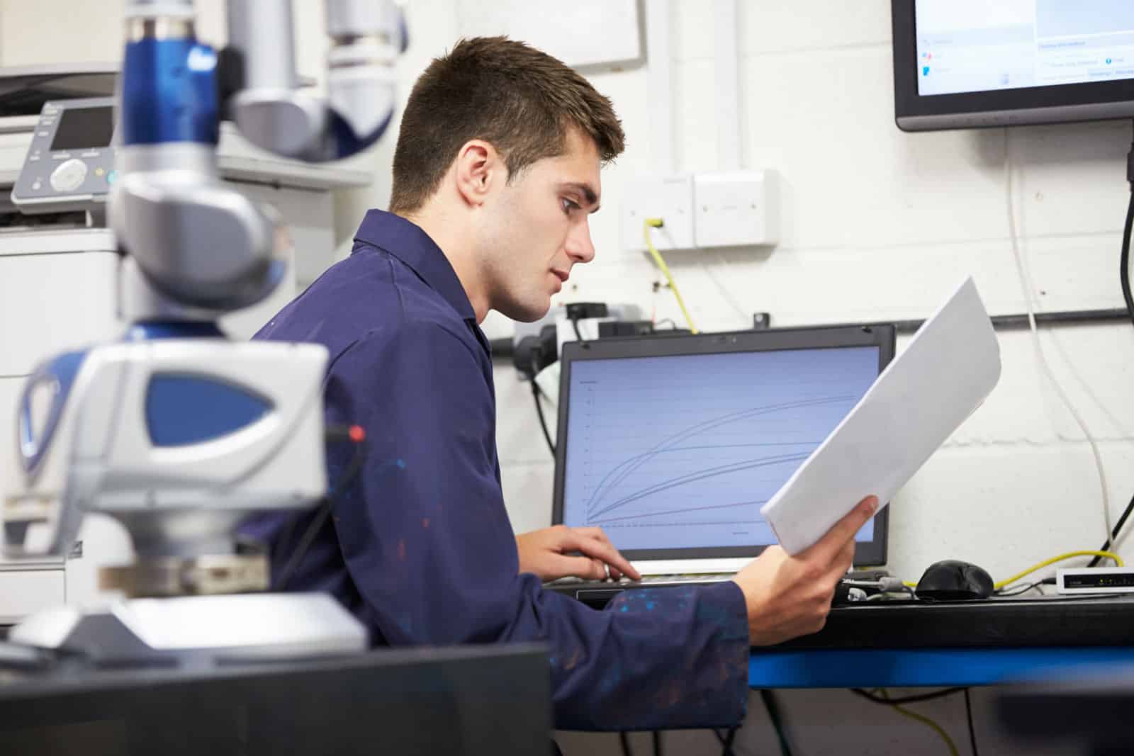 Man Inspecting Details Of A Project